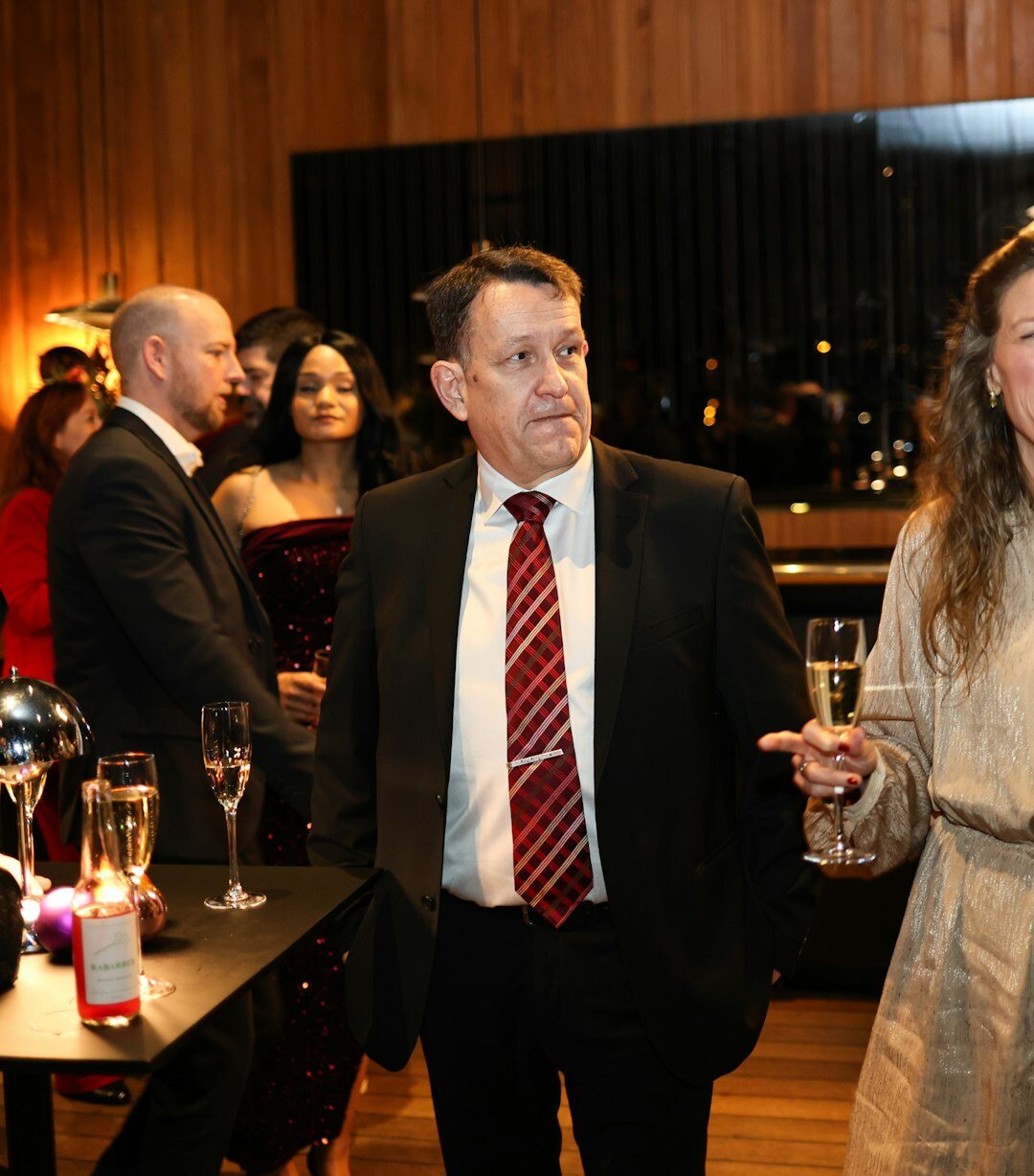 Elegant Latin American couple arriving at a cultural gala in Buenos Aires